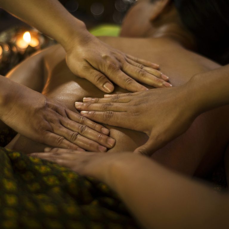 traditional asian thai four hand massage  in tropical spa detail